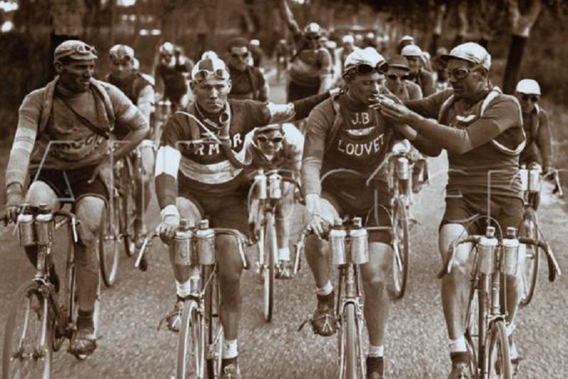 Cyclists at the Tour de France in the 1920s smoking cigarettes. It was thought that cigarette smoking expanded the lungs, and helped with endurance.jpeg