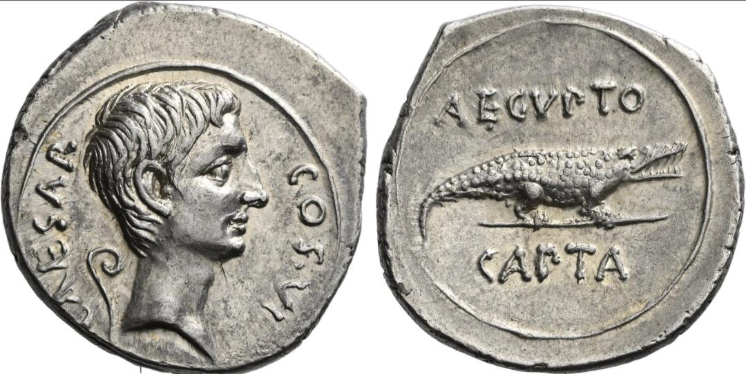 A denarius minted by Augustus to celebrate the capture of Egypt after the battle of Actium where he defeated Mark Antony and Cleopatra.jpeg