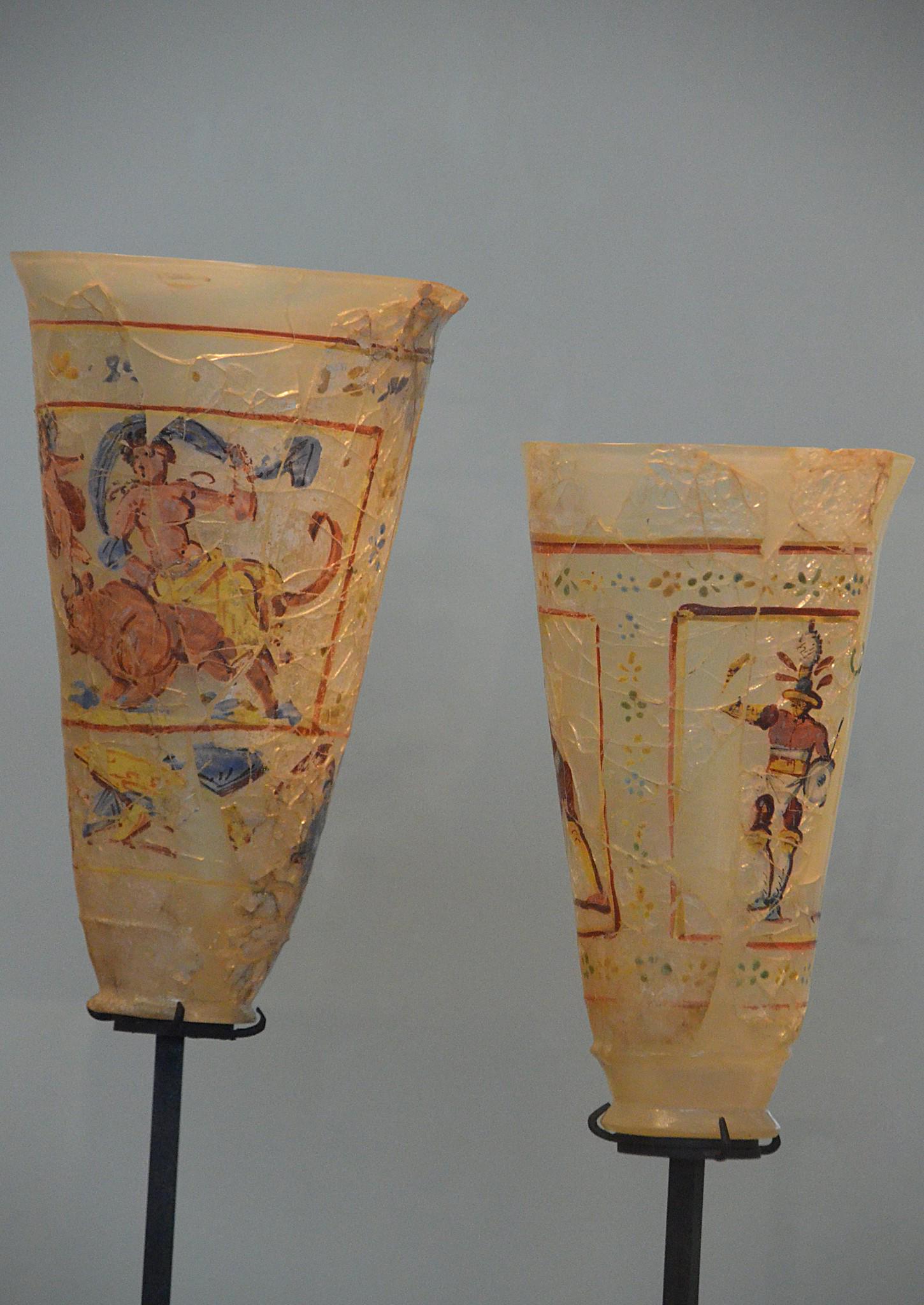 Two painted Glasses showing the abduction of europa(left) and a roman gladiator(right), 1st century CE, Afghanistan.jpeg