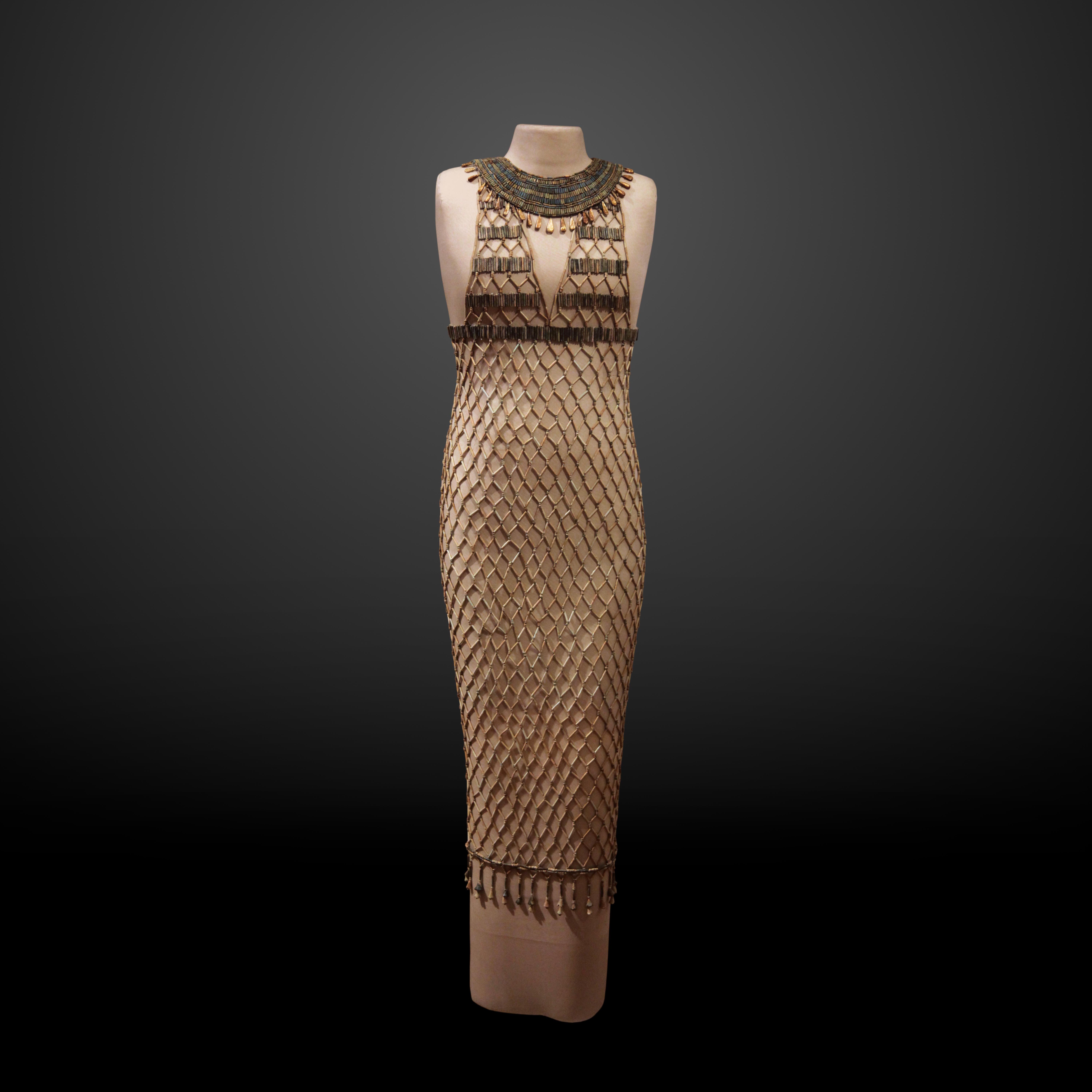 Egyptian faience beaded fishnet dress dating from the Fourth Dynasty, c. 2550 BCE.jpeg