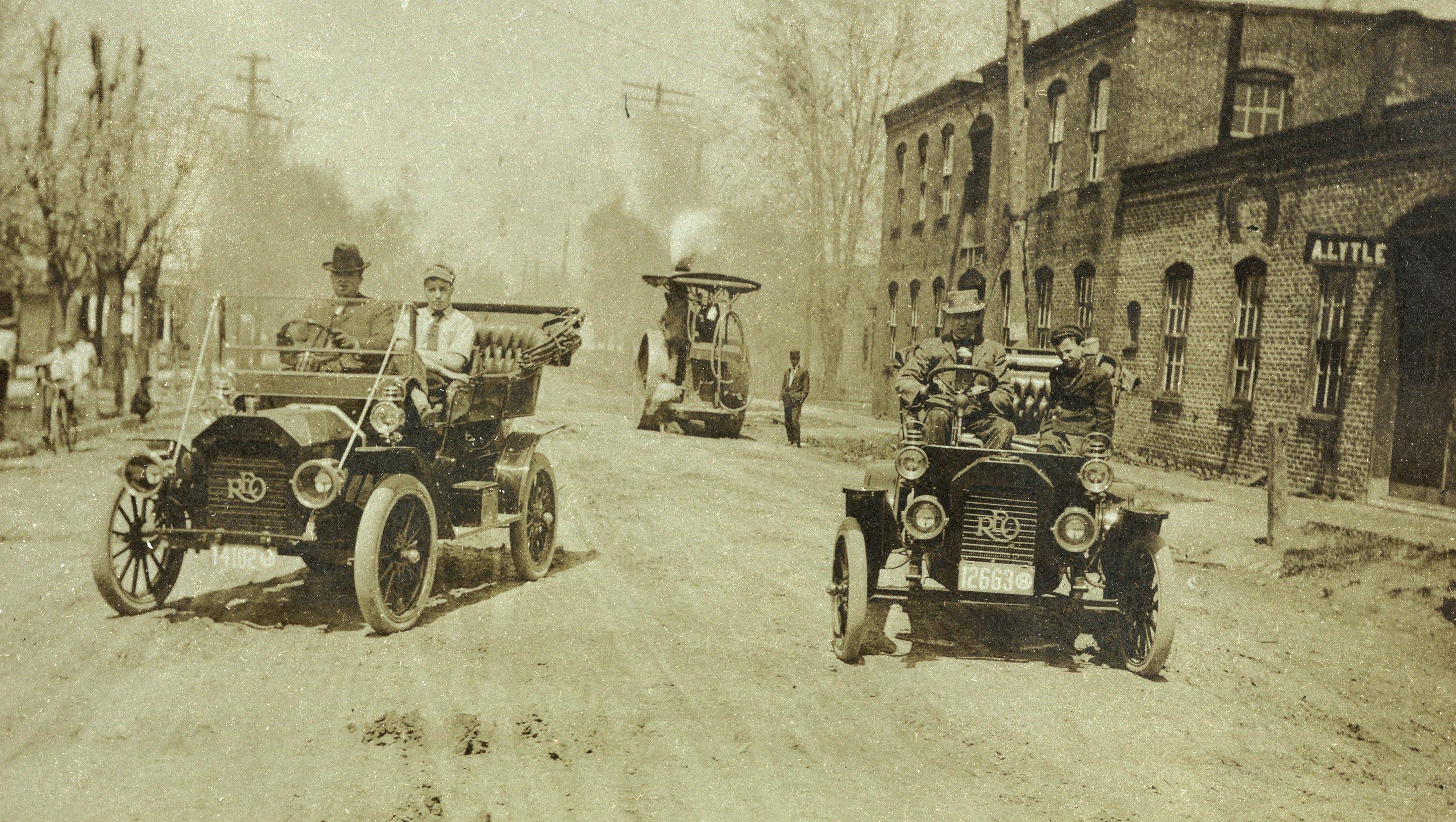 Today my pic is a couple REO Speedwagons...my Great Grandfather is all the way on the right. This is in Carey, Ohio, I believe. I think it is such a cool photo though...est. 1915.jpeg