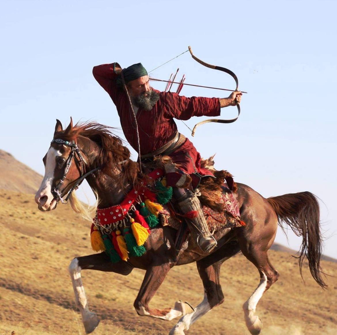 Ali Ghoorchian, an Iranian world-champion horseback archer, performs the famous Parthian shot.jpeg