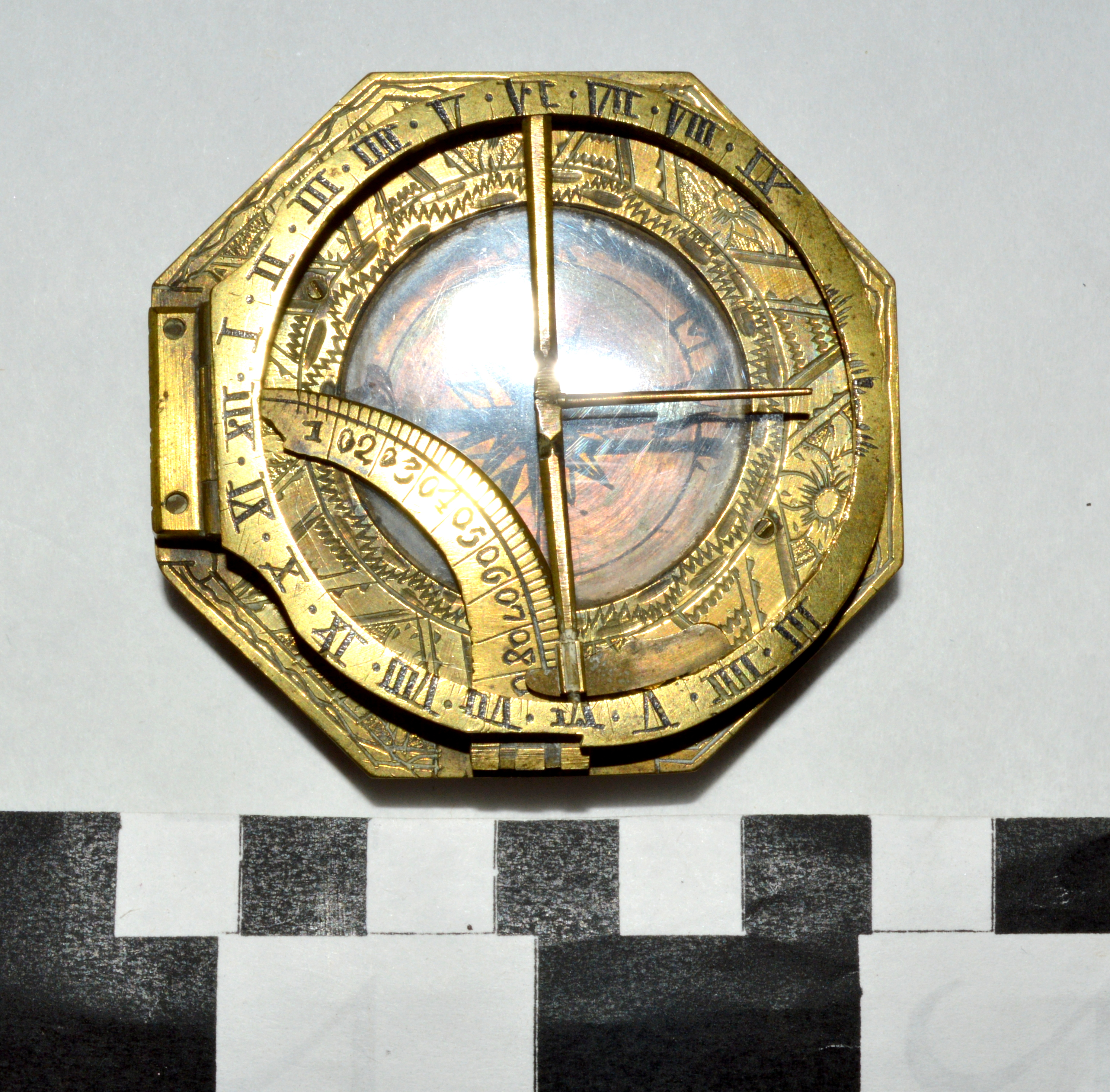 A brass pocket equinoctial compass (combination sundial and compass) that reputedly belonged to a pirate of the Spanish Main, c. 1750-1790.jpg