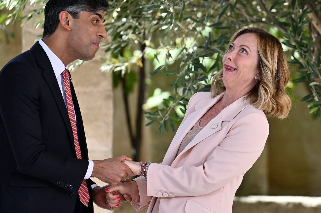 The British prime minister greeting the Italian prime minister at the 50th G7 summit.png
