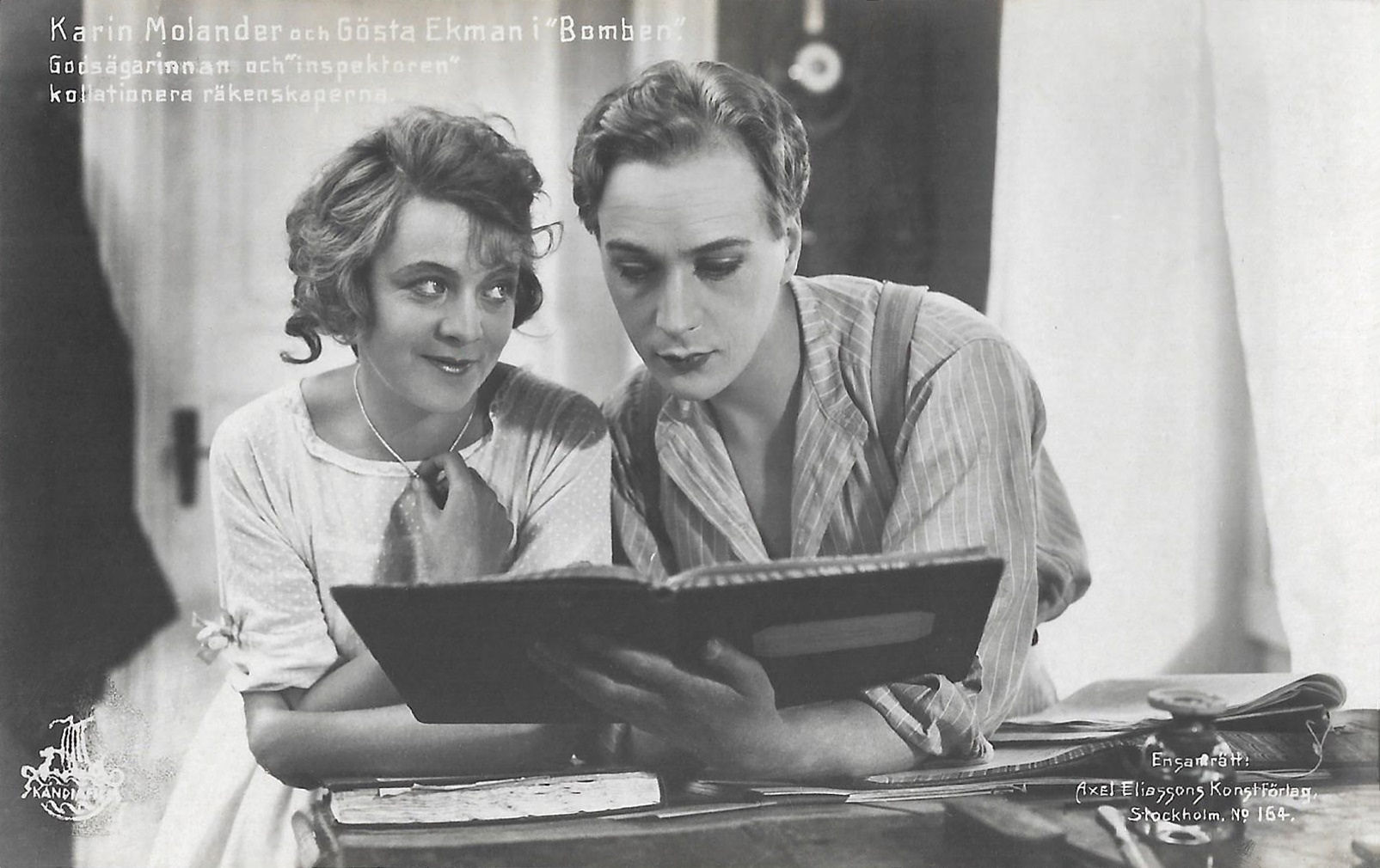 Skandia Film. Gösta Ekman and Karin Molander in the Swedish silent comedy Bomben (Rune Carlsten, 1920). Caption - The estate manager and the inspector check the accounts..jpg