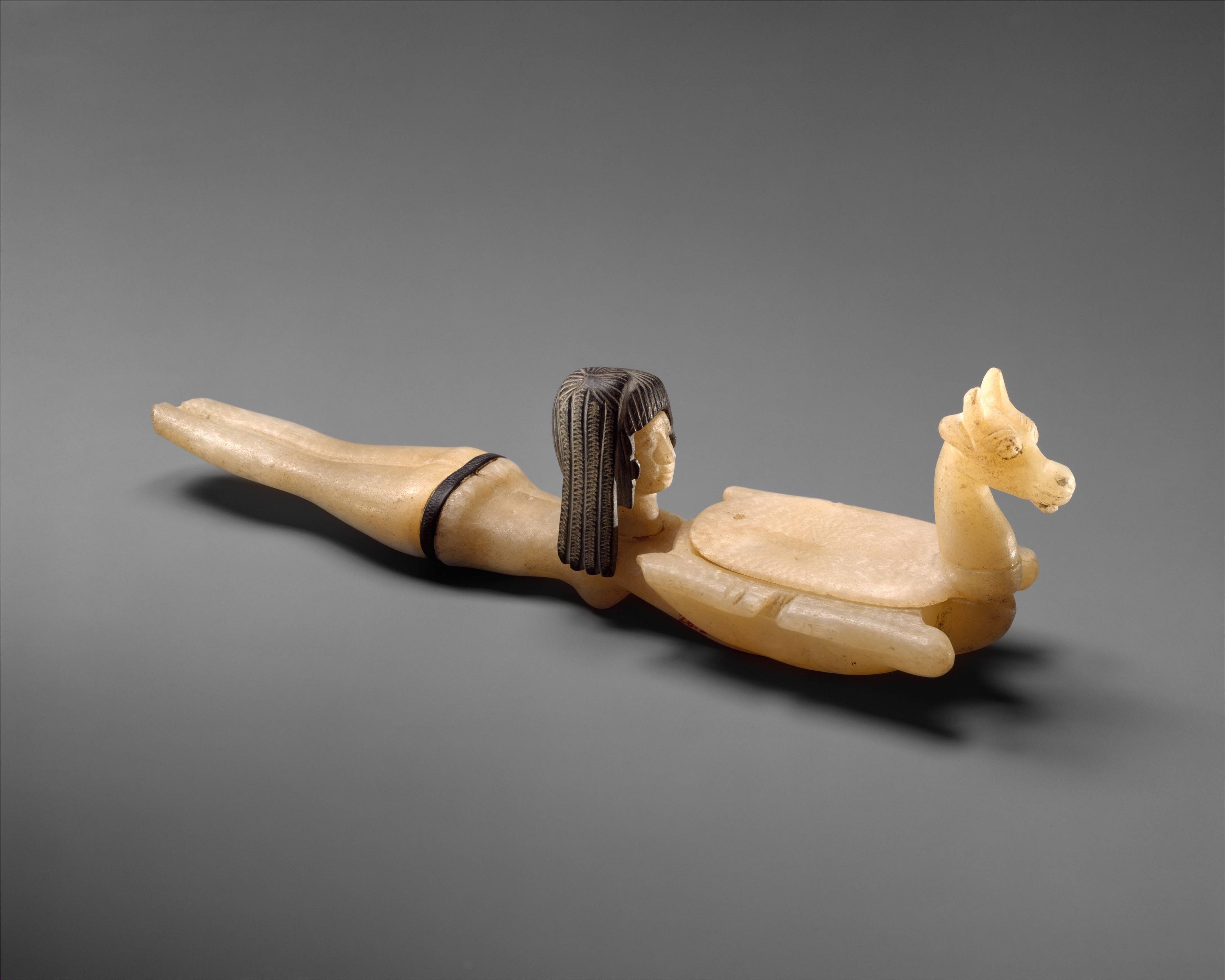 Cosmetic Spoon in the Shape of Swimming Woman Holding a Dish (1390 BC) - Egypt.jpeg