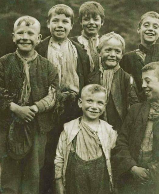 A group of smiling Victorian boys 1898.jpeg