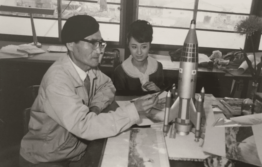 Keiko Sawai and Akira Watanabe with the Model of P-1 for Invasion of Astro-Monster (1965).png