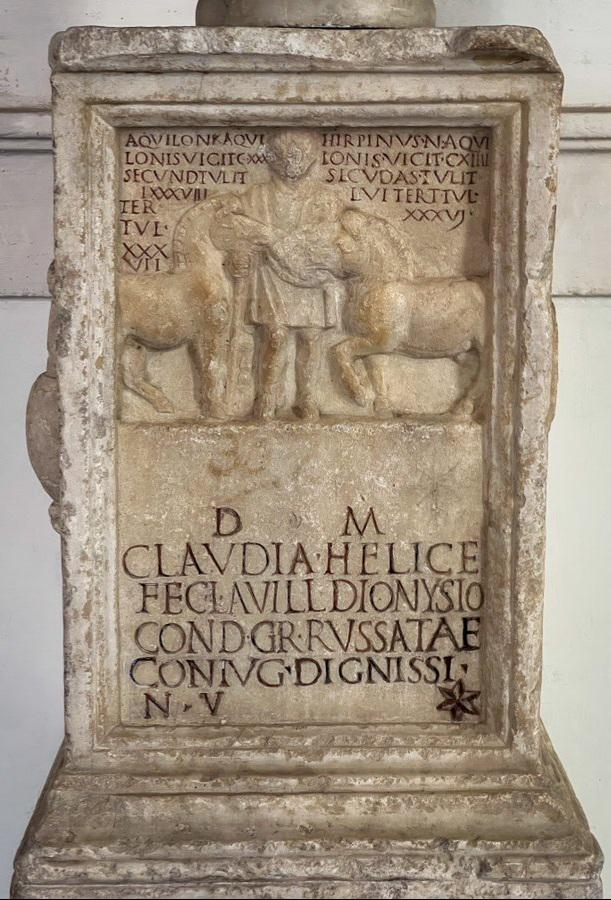 Tombstone of Lucius Avillus Dionysius, trainer of the Red Team, which is one of the 4 teams that competed in ancient Roman chariot racing.jpeg