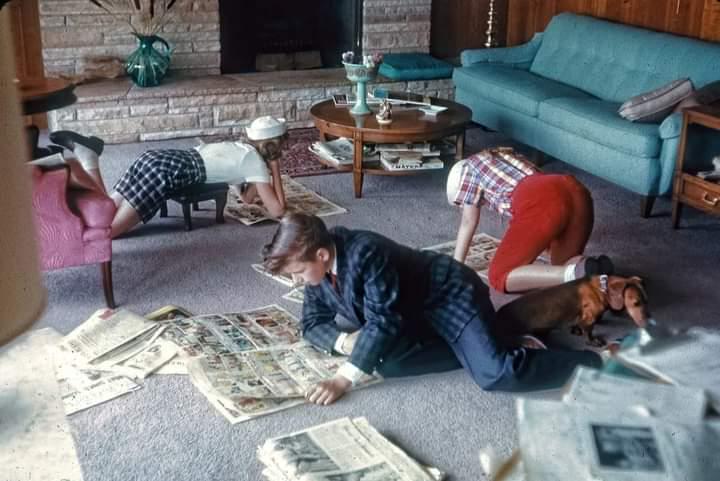 Reading the Sunday comics. 1950s.jpeg