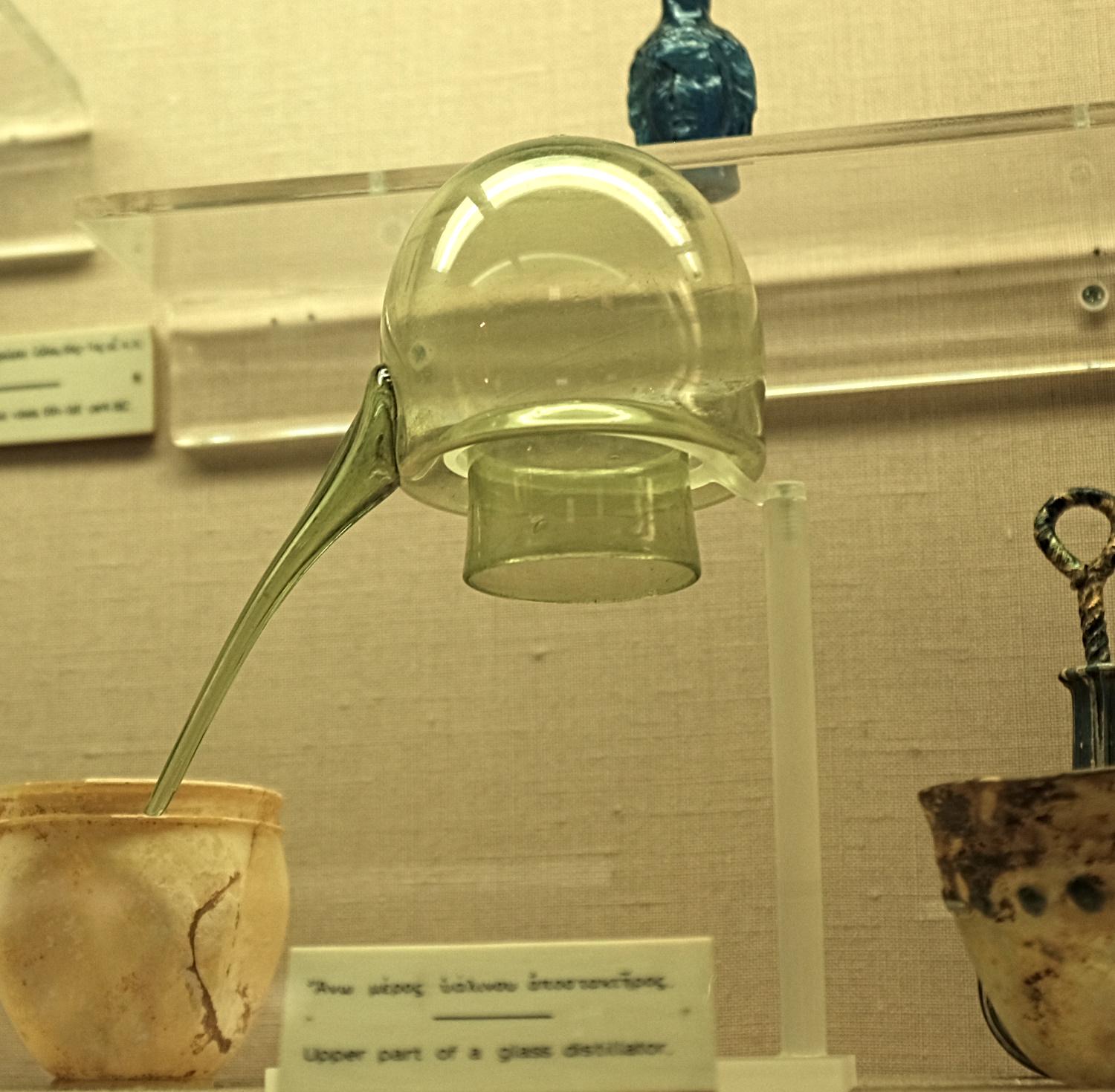 Upper part of a distillator-alembic, made of glass. Cyprus, unclear dating [starting at the 6th c. BCE, possible terminus ante quem 7th c. CE]. Housed in the Cyprus museum.jpeg