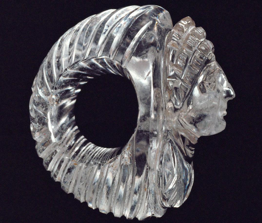 A large Roman rock-crystal ring, bearing the portrait of a woman in extremely high relief, her ornate three-tiered hairstyle popular around the year 100 AD..jpeg