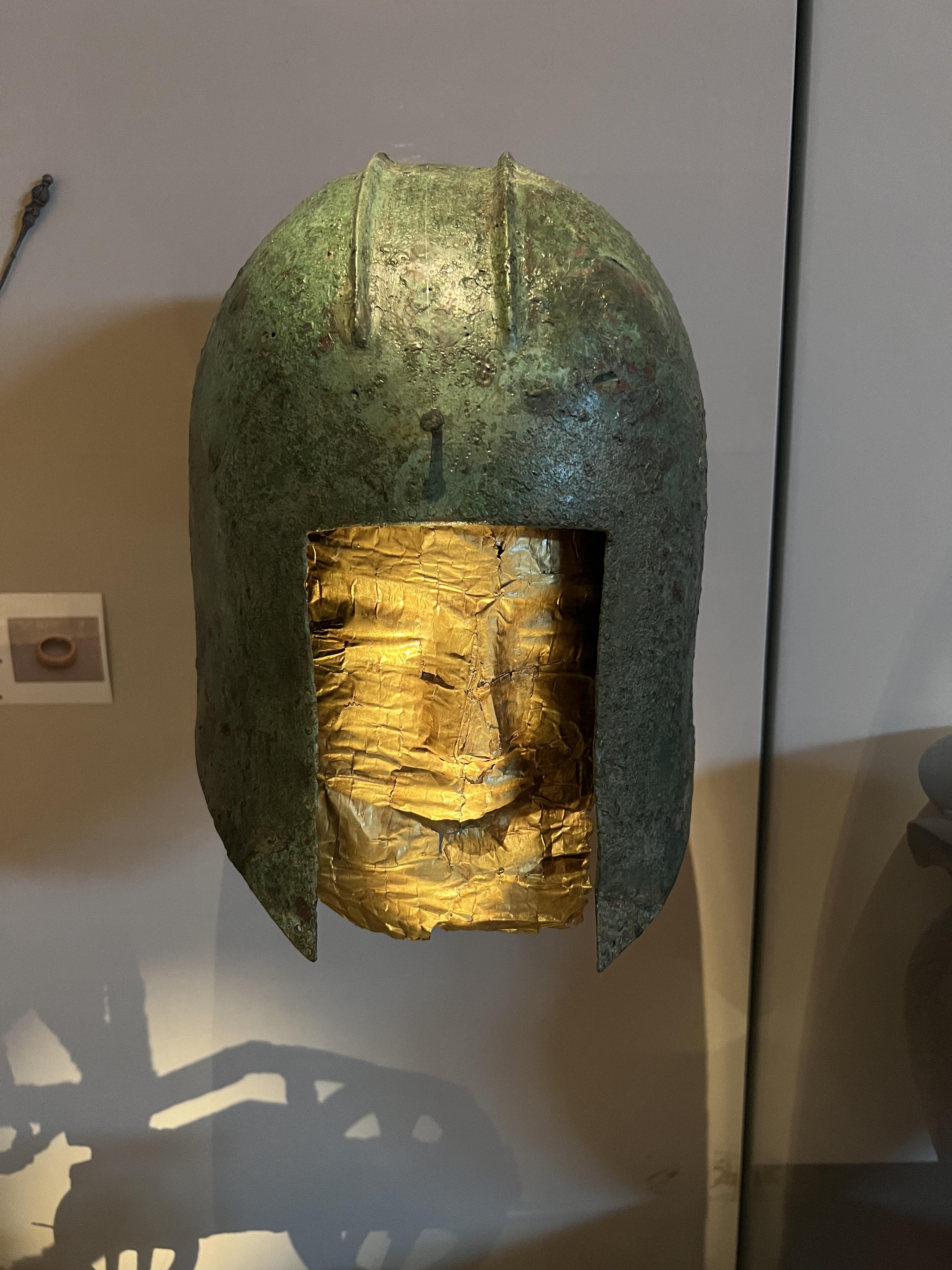 Bronze helmet of the Illyrian-type with a gold mask from the Sindos cemetery, made at the end of the 6th century BCE and now located at the Archaeological Museum of Thessaloniki.jpeg