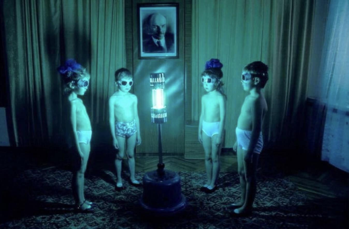 Soviet children in Siberia standing in-front UV light baths during winter, 1980s.jpeg