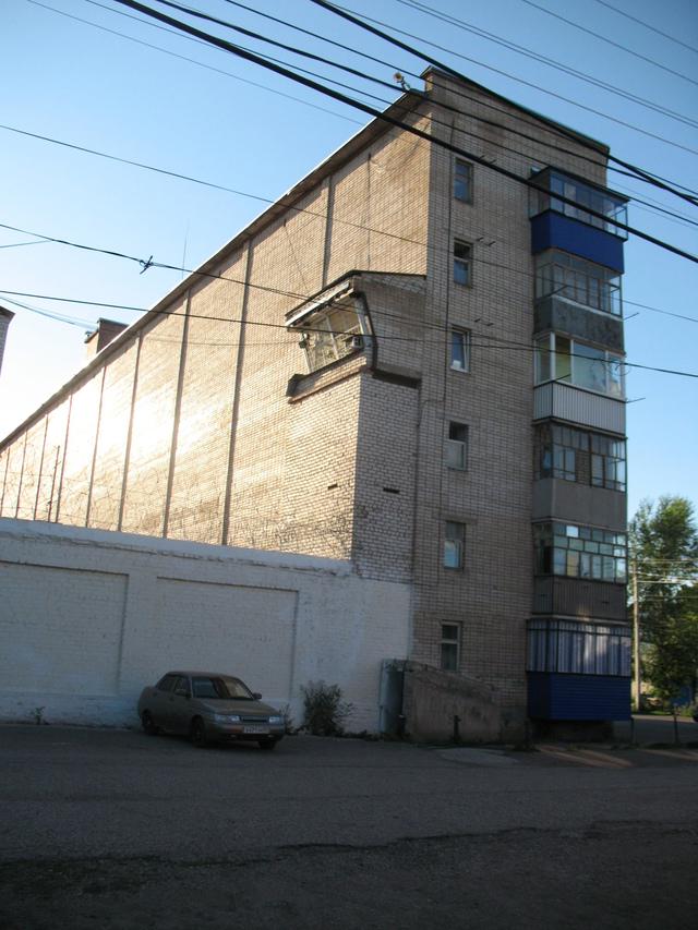 A house for the families of prison guard with built-in watch tower, Next to Prison, Sterliamak, Russia.jpeg