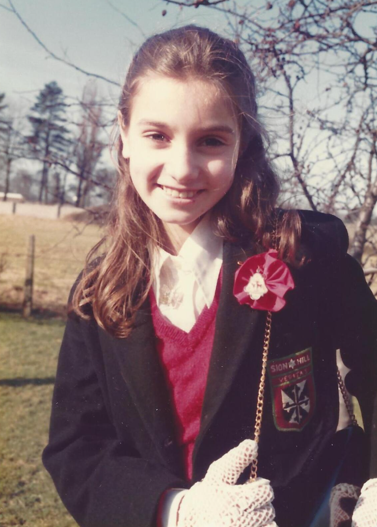 Schoolgirl with cool gloves in Ireland 1980, named Sinéad.png
