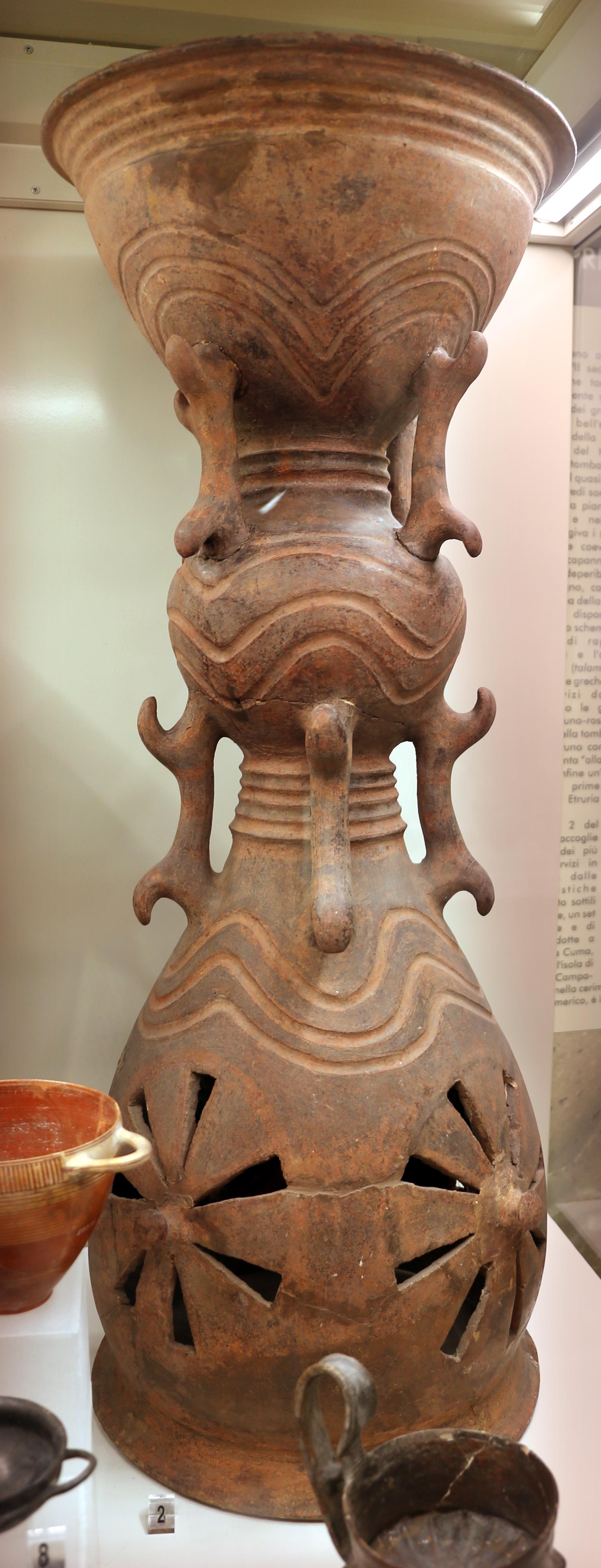 An Etruscan terracotta holmos (stand) from tomb 2 of the banditaccia in Cerveteri, Italy. Ca. 700-670 BCE, now housed at the National Etruscan Museum in Rome.jpeg