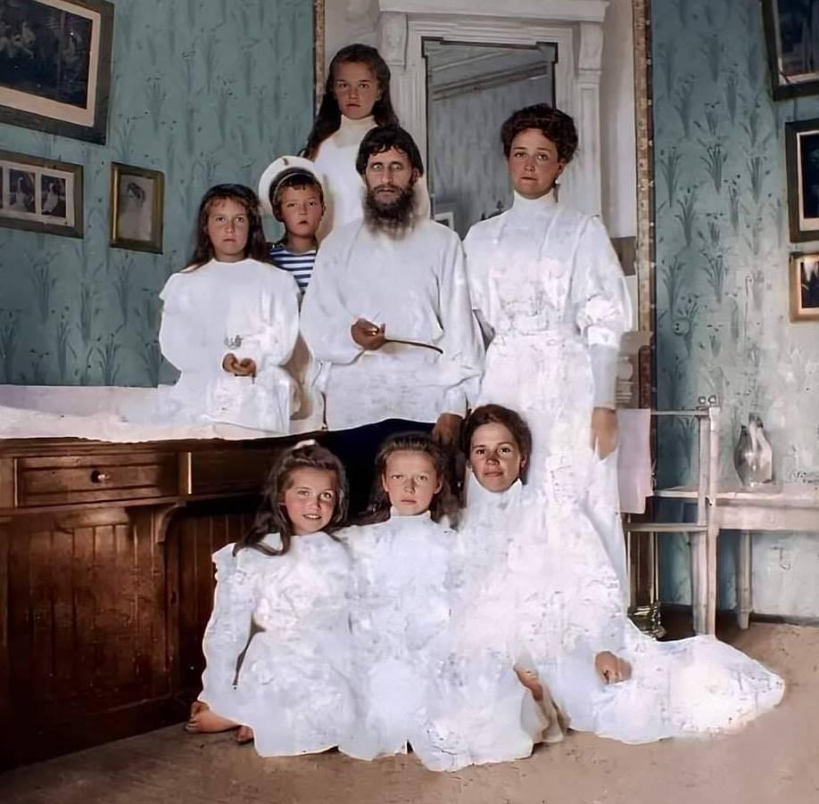 A Colorized Photo Of Grigori Rasputin With The Last Empress Of Russia And Her Five Children In 1908.jpeg