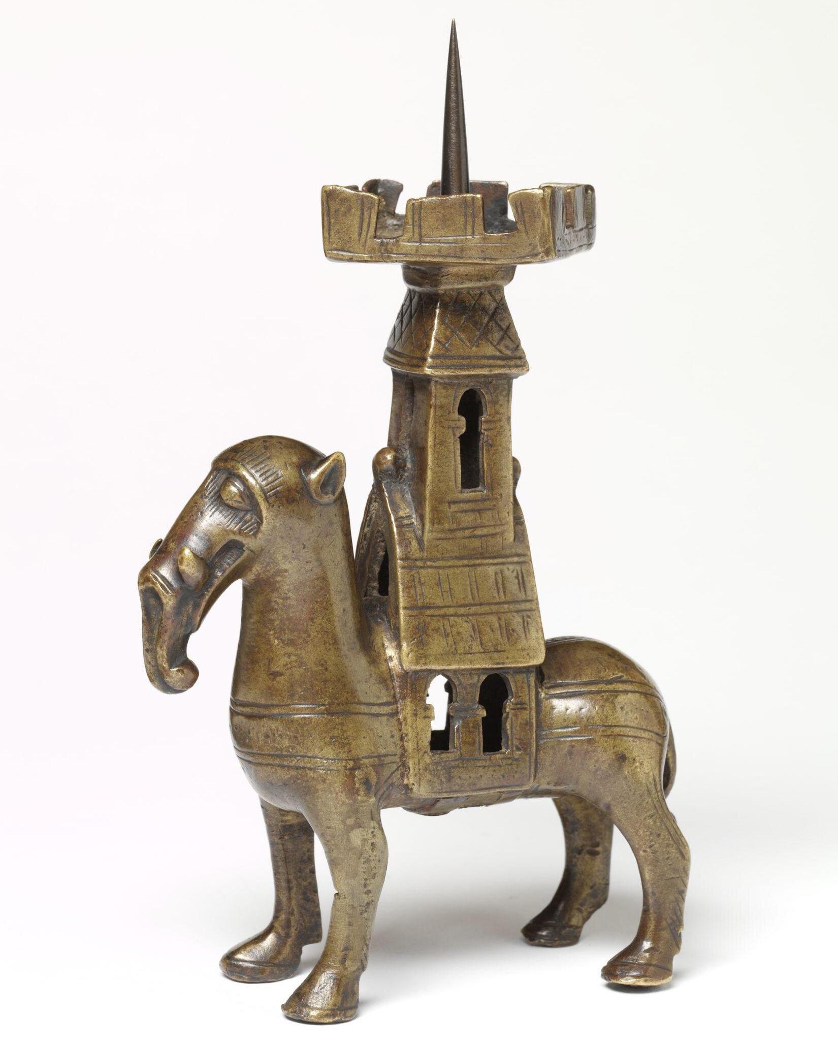 ronze candlestick shaped like an elephant carrying a castle. Germany, 1200-1400 AD.jpeg