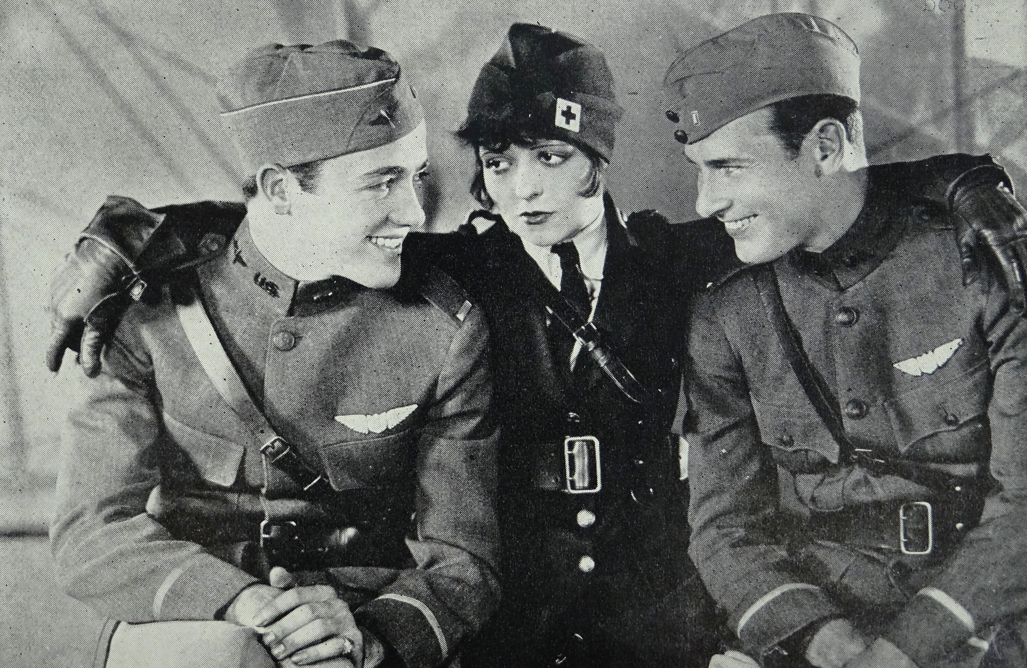 Wings, by John Monk Saunders (1927). Charles Buddy Rogers as Jack Powell, Clara Bow as Mary Preston and Richard Arlen as David Armstrong.jpg