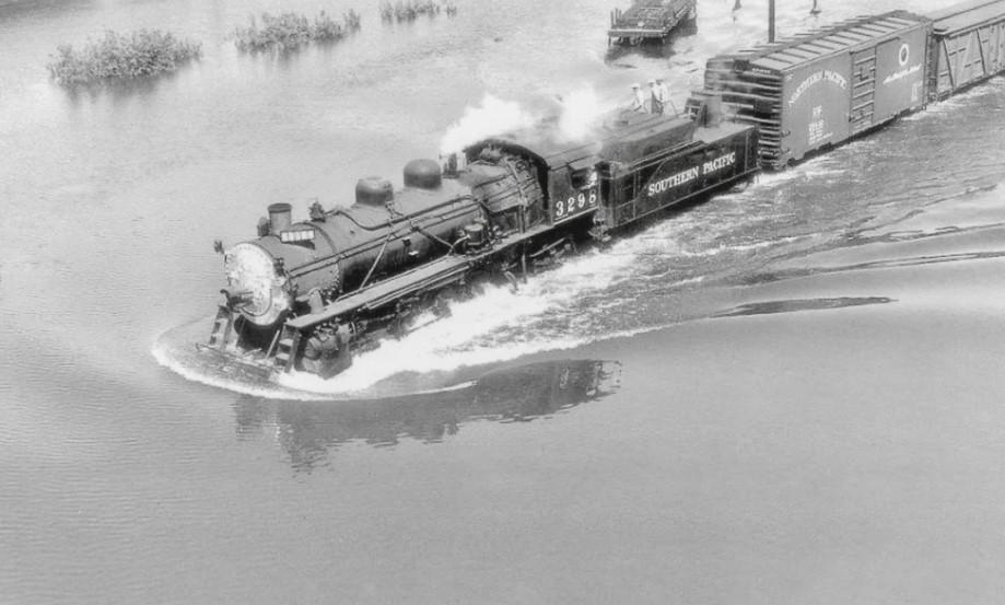 Southern Pacific freight train plows through floodwaters, circa late 1940s.jpeg