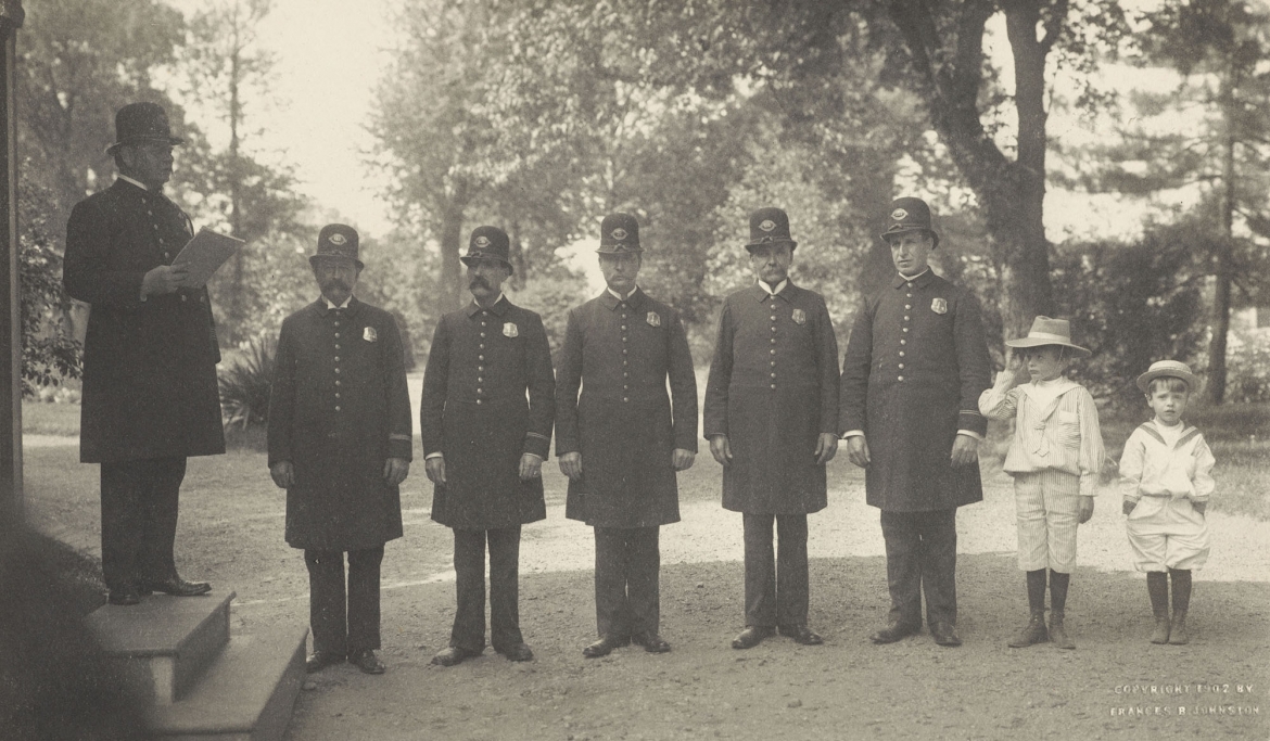 Archie and Quentin Roosevelt with White House police officers, 1902.jpg