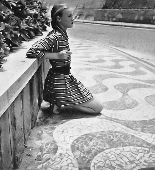 Bobby Munroe in black-and-white striped cotton beach jacket by Carolyn Schnurer, photo by Louise Dahl-Wolfe, Harper's Bazaar, May 1946.jpg