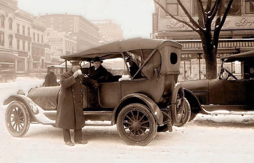 A police officer enjoys a warm cup of coffee and salutations on a cold winter day in Washington DC, 1919.jpeg
