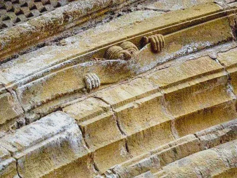 One of the 4 angels curious about the outcome of the Last Judgment. Details from the 12th century CE Abbey Church of Sainte-Foy in Conques, France.jpeg