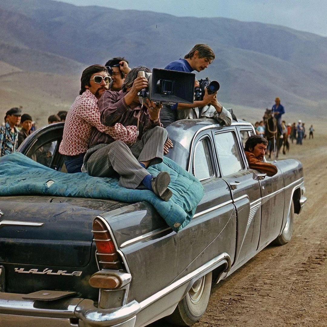 Cameramen filming from a roofless GAZ-13 Chaika, (1978), Kemin, Kyrgyz SSR. Photograph - Alexander Fedorov.jpeg