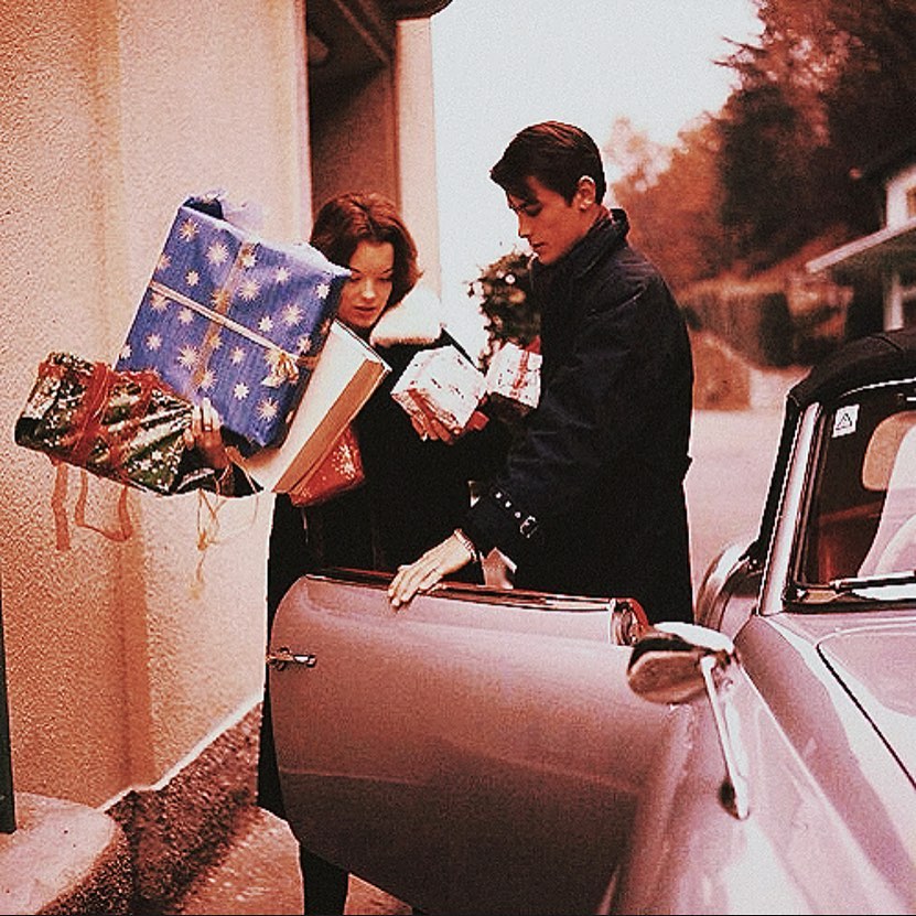 Romy Schneider and her boyfriend, Alain Delon, are photographed decorating their home for Christmas, 1959 4.jpg