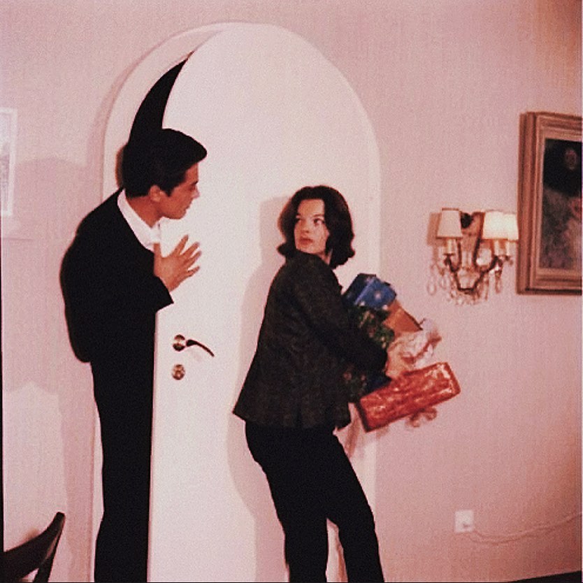 Romy Schneider and her boyfriend, Alain Delon, are photographed decorating their home for Christmas, 1959 3.jpg