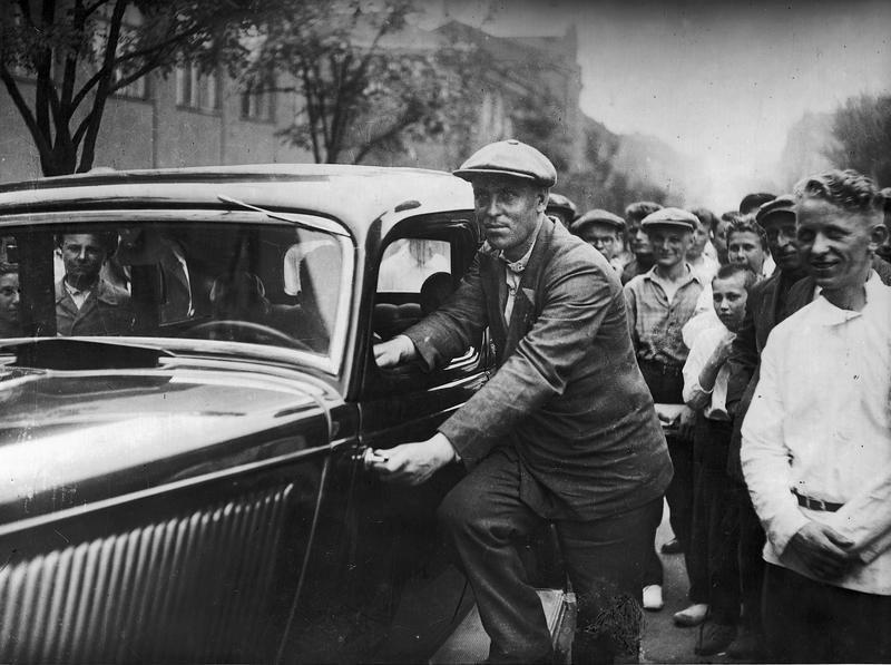 Alexei Stakhanov with a car given to him by Stalin, 1936.jpeg
