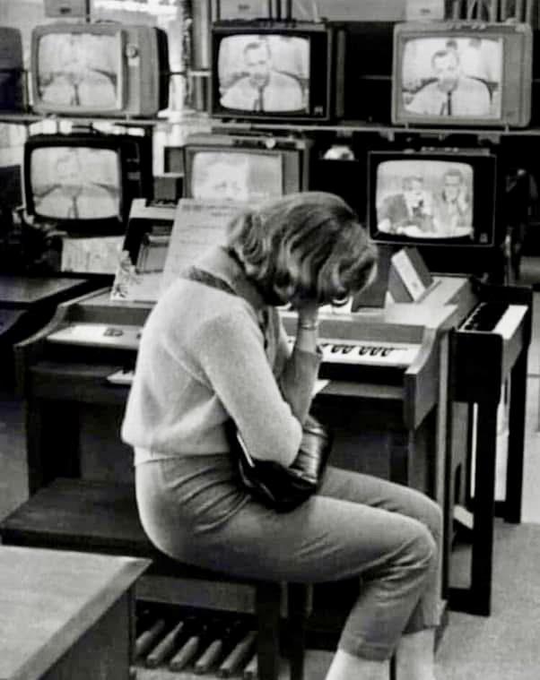 A woman mourns the news of JFK’s assassination in a department store on November 22, 1963.jpeg
