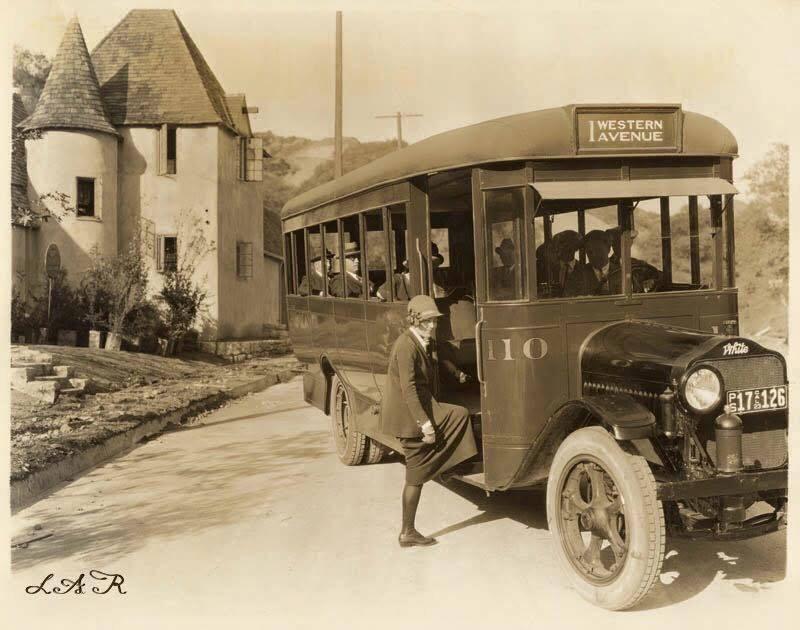 1923. Woman boards a crowded Los Angeles Motor Bus bound for Western Avenue, Los Angeles, California.jpeg