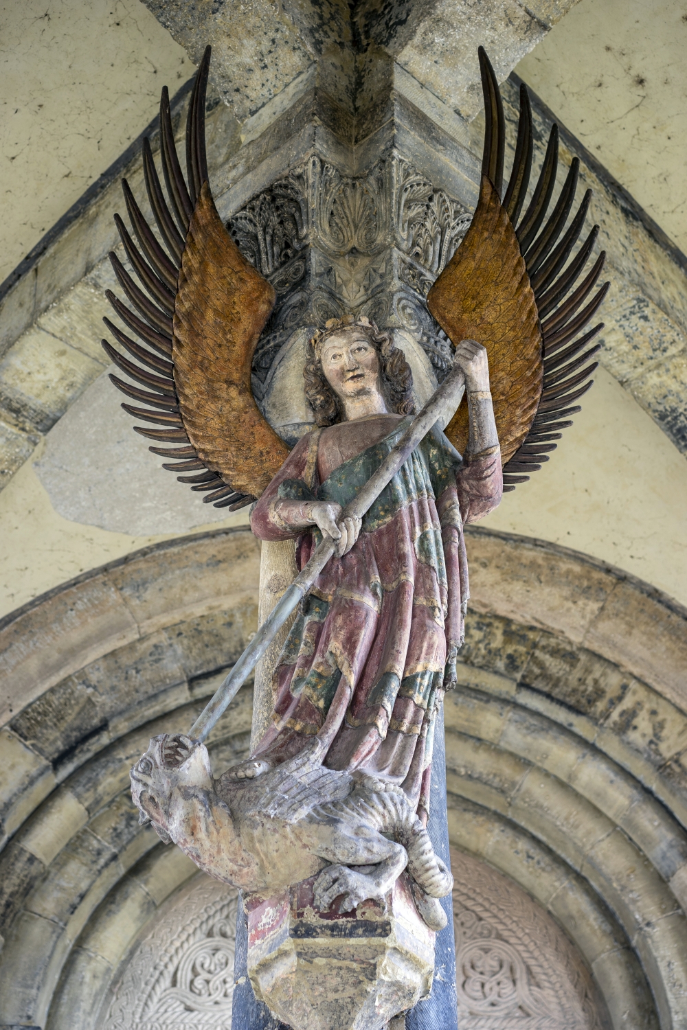Early Gothic statue of archangel Michael slaying the dragon (13th century).jpg