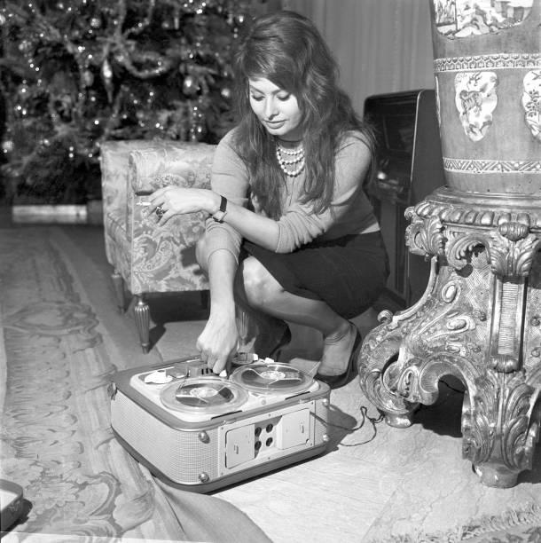 Sophia Loren with a reel-to-reel tape recorder at her home during the Christmas period, 1960.jpeg