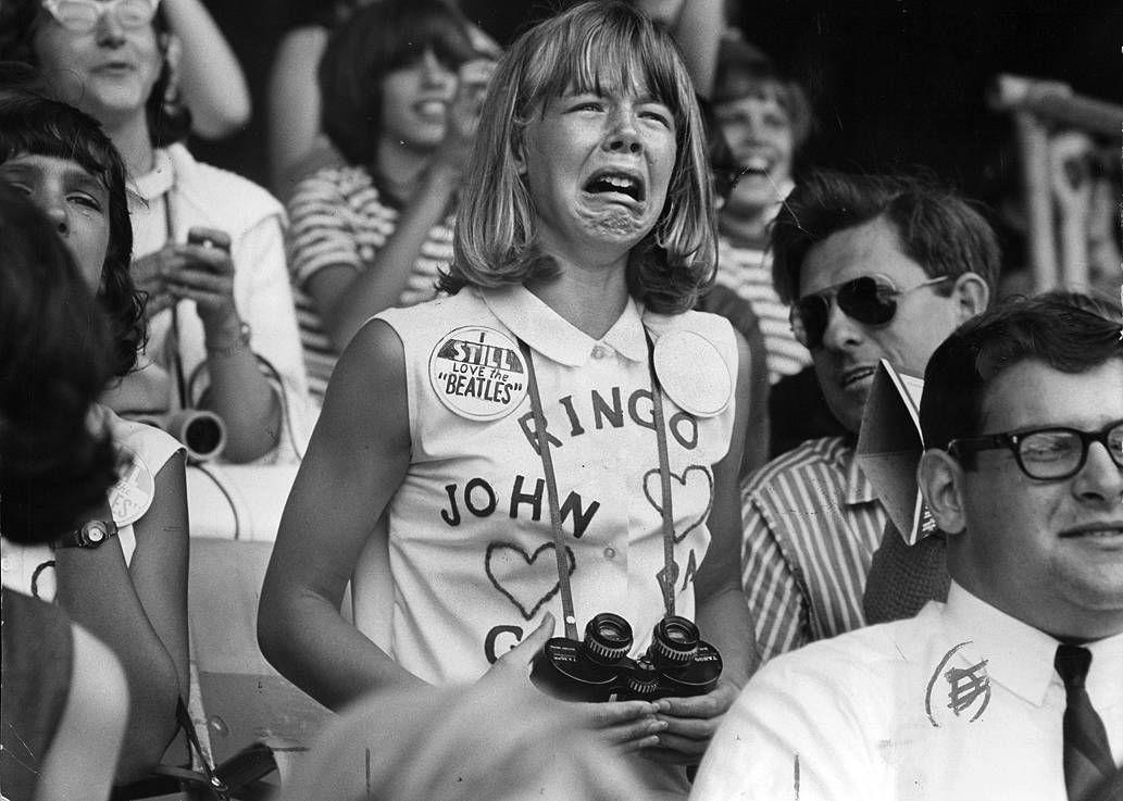 Teens watch the Beatles perform at Comiskey Park in Chicago on Aug. 20, 1965.jpeg