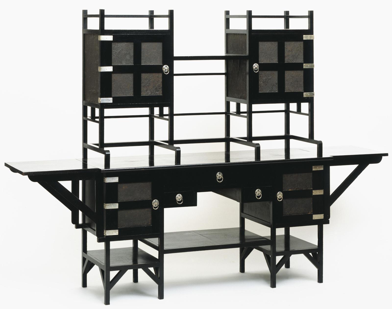A sideboard made in 1867-1870 CE by Edward William Godwin in the Anglo-Japanese style. Ebonised mahogany with silver plated handles and embossed paper panels.jpeg
