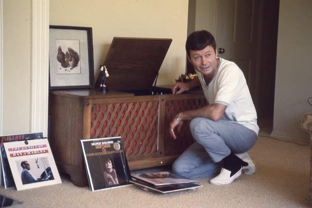 DeForest Kelly of Star Trek with his vinyl collection and console in the 1960s.jpeg