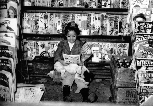 1947 a well-managed newsstand with titles in alphabetical order.jpg